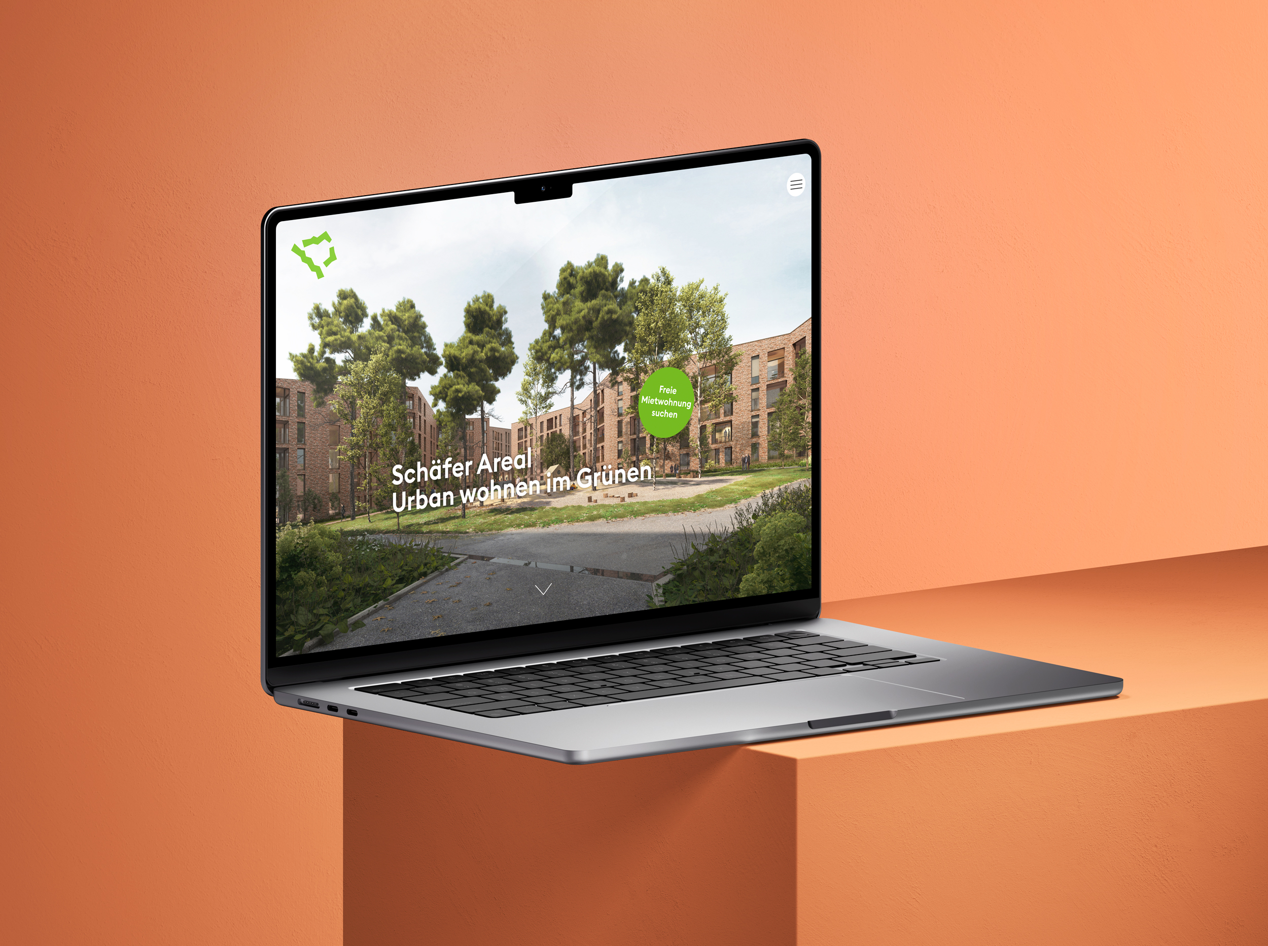 Schäfer Areal Website auf Laptop Macbook mit dem Slogan "Urban wohnen im Grünen“